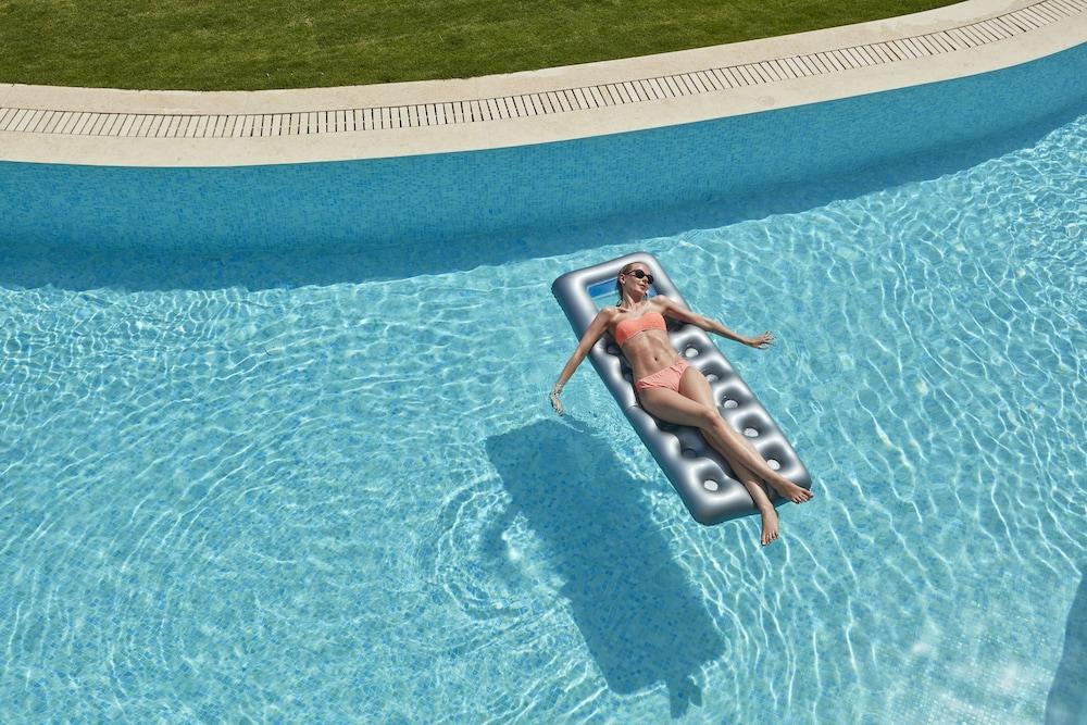 Elissa Adults-Only Lifestyle Beach Resort Kallithéa エクステリア 写真 A woman on a pool float